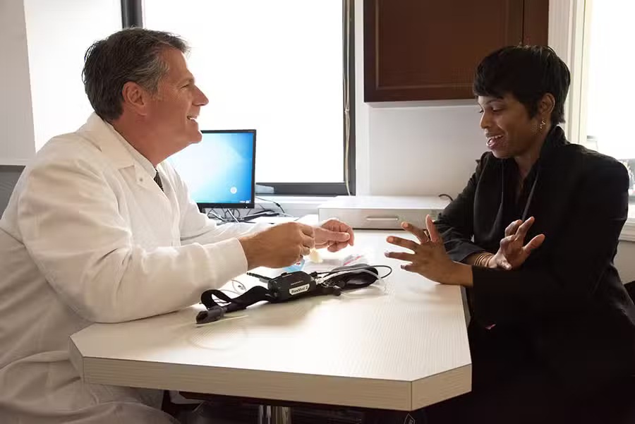 Doctor discussing sleep apnea treatment with a patient during an in-office consultation – sleep apnea treatment midtown nyc